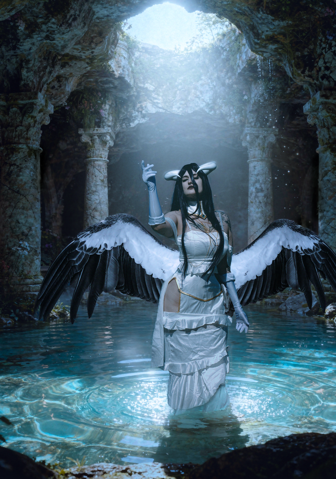 Cosplayer in a light white dress outfit standing in the middle of a moon cave Albedo overlord cosplay by Hekixo